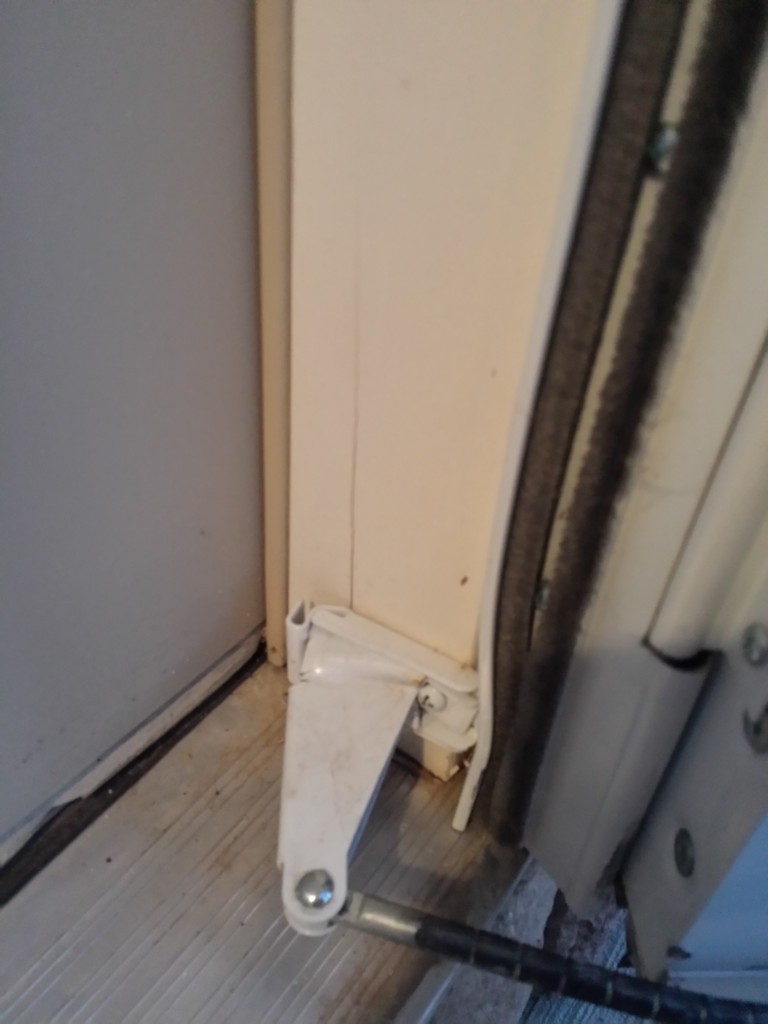 Crack in wood where door closer is mounted